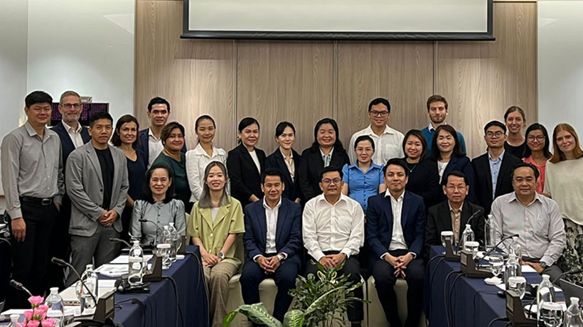 Participants pose together in a meeting room